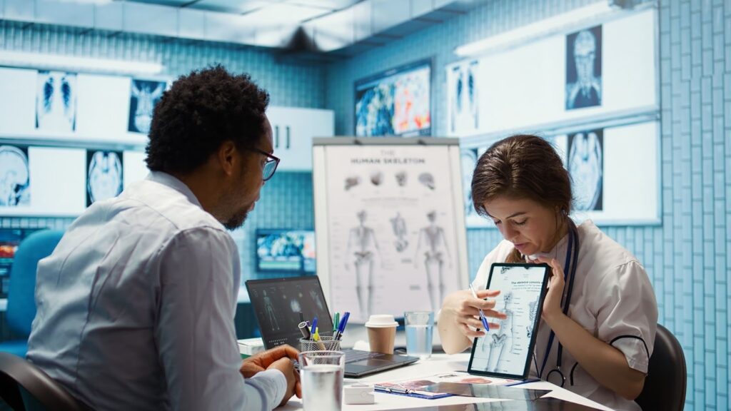 healthcare provider presenting laboratory test results to a patient in the office