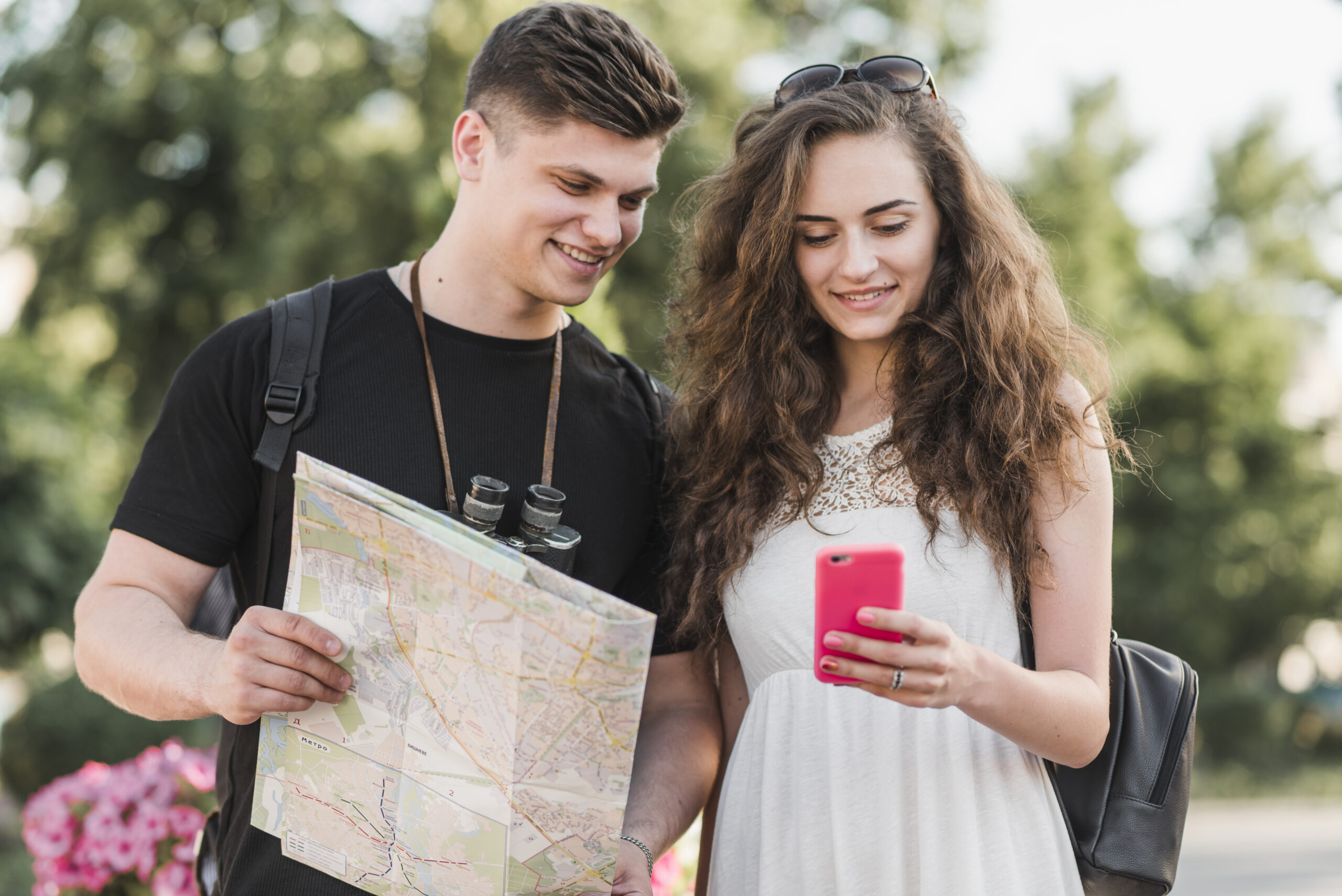 couple with map using smartphone