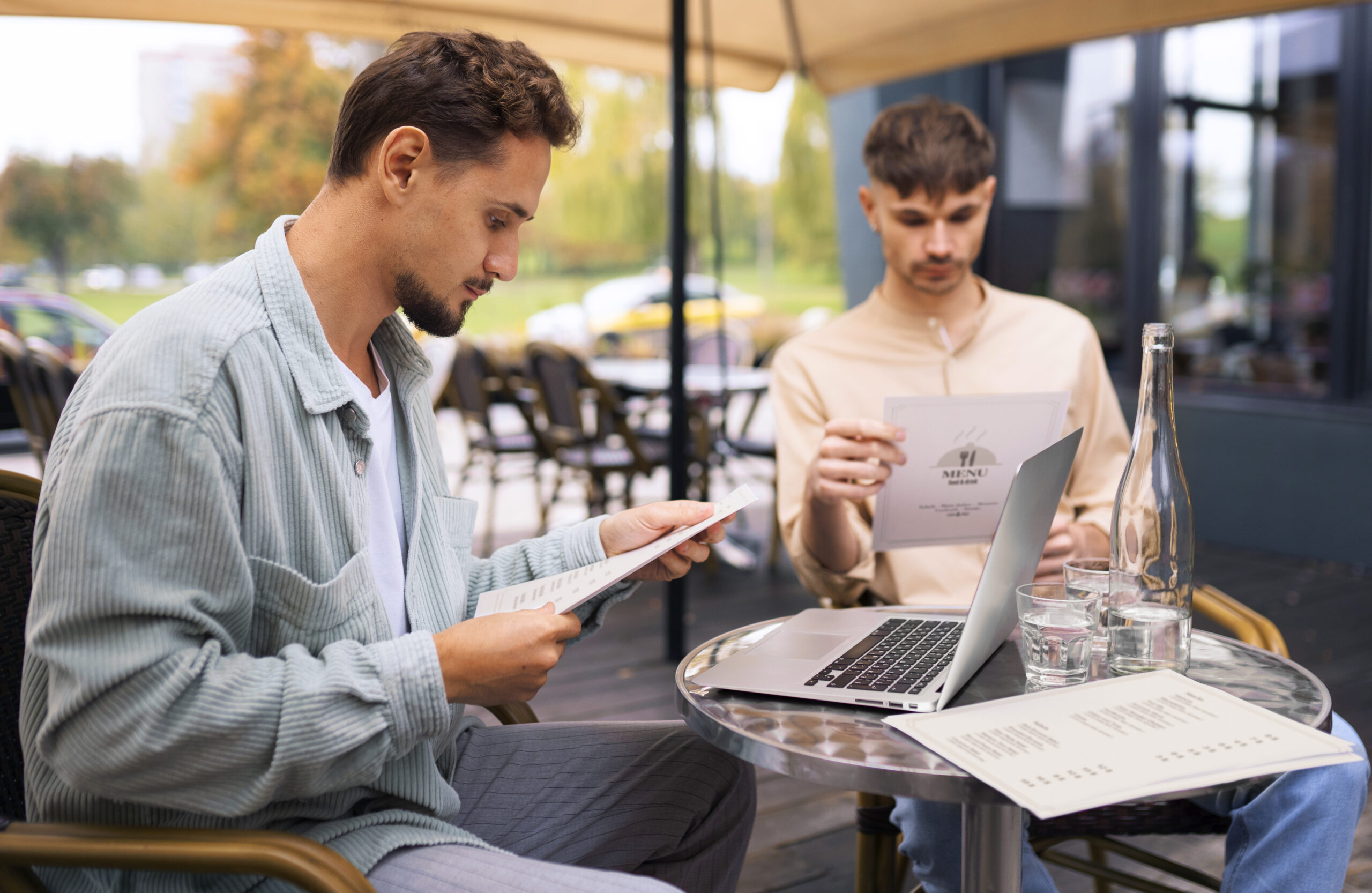 friends with mid-range shots and menus at the restaurant