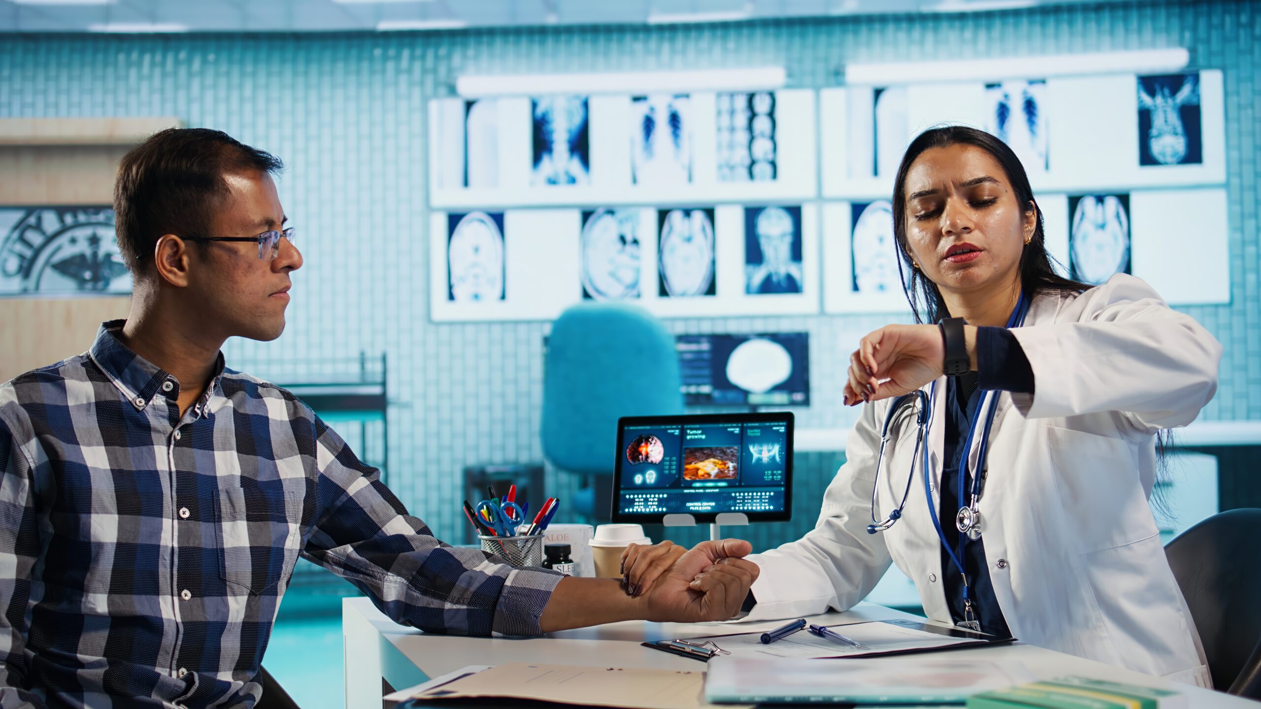 Expert using smartwatch to measure patient heart rate and heartbeat