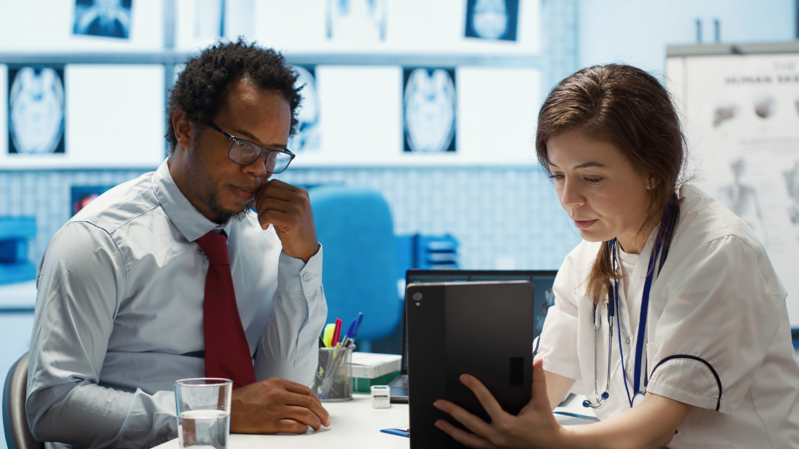 General practitioner presenting the test findings via scan interpretation on tablet
